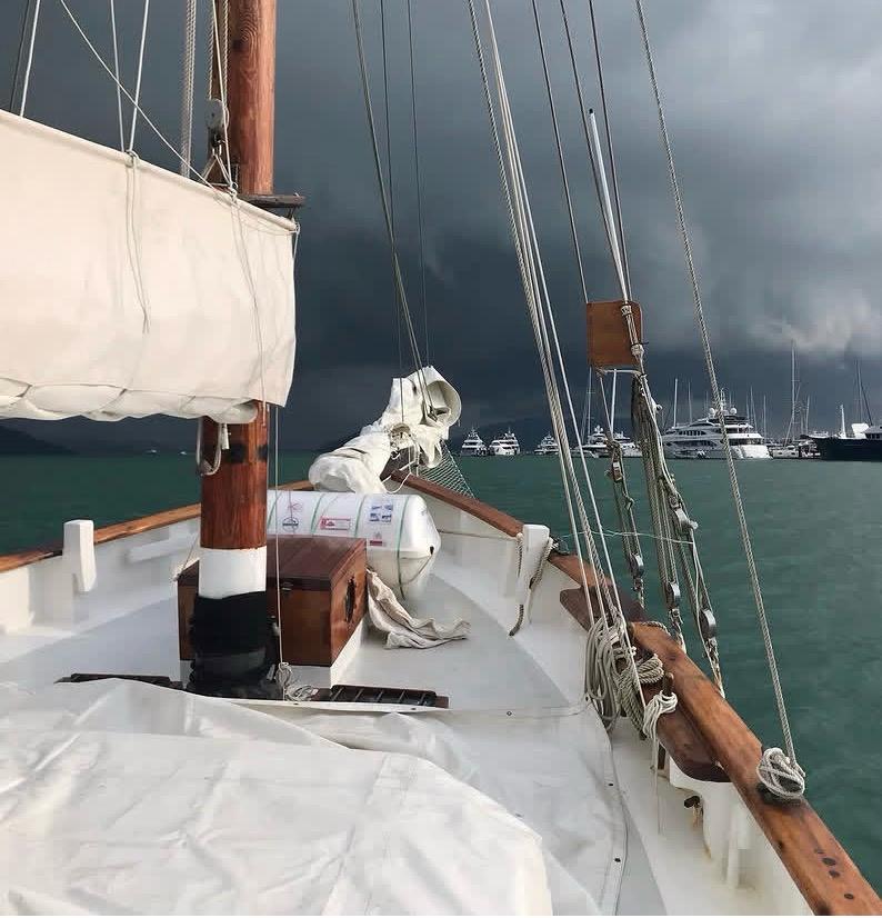 Seraph's deck with a dramatic squall building over the Andaman Sea